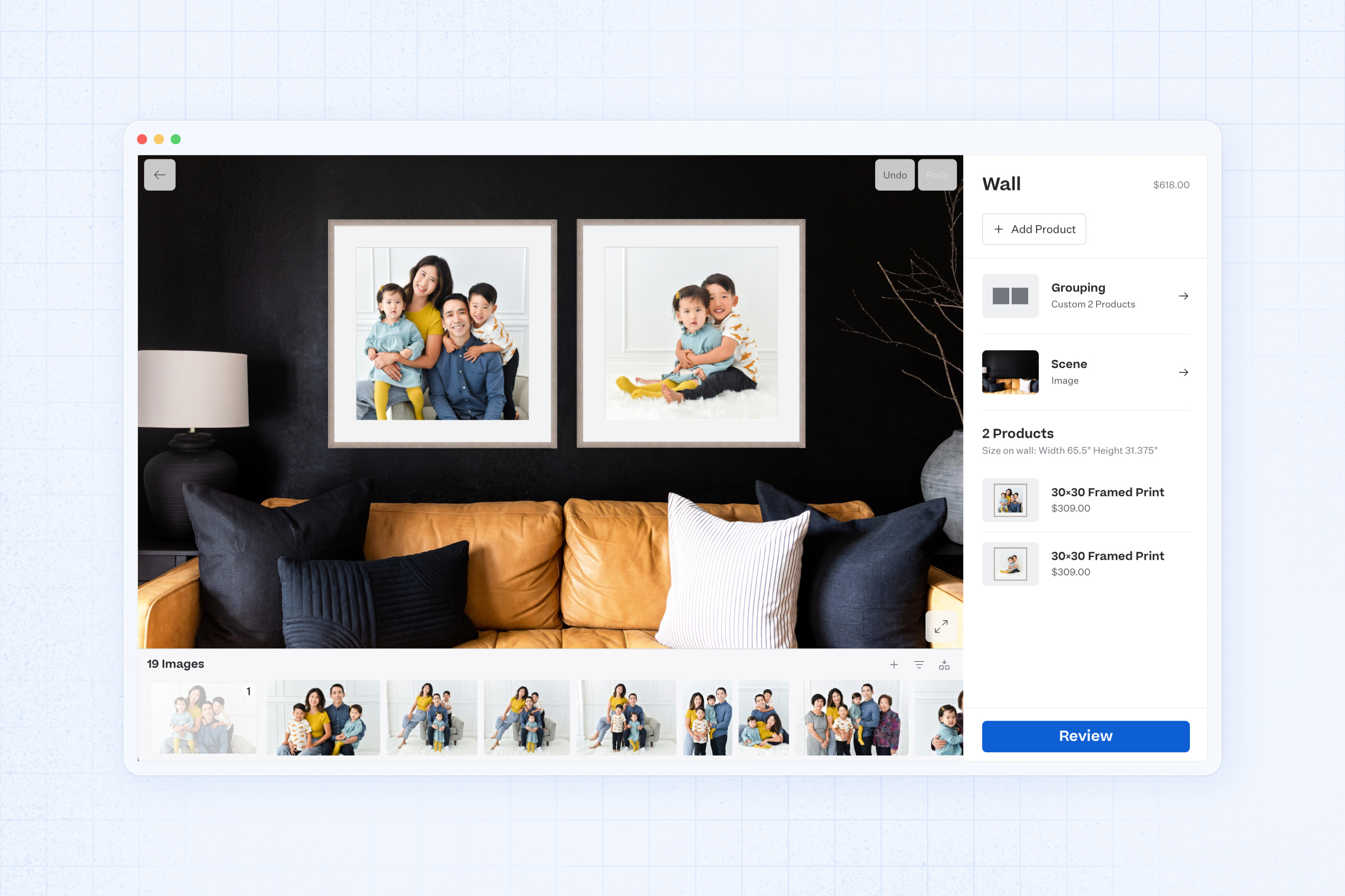 Two 20×20 Gramercy Framed Prints with family portraits hung on a living room wall, painted black with a camel colored couch and high-contrast neutral accent decor.