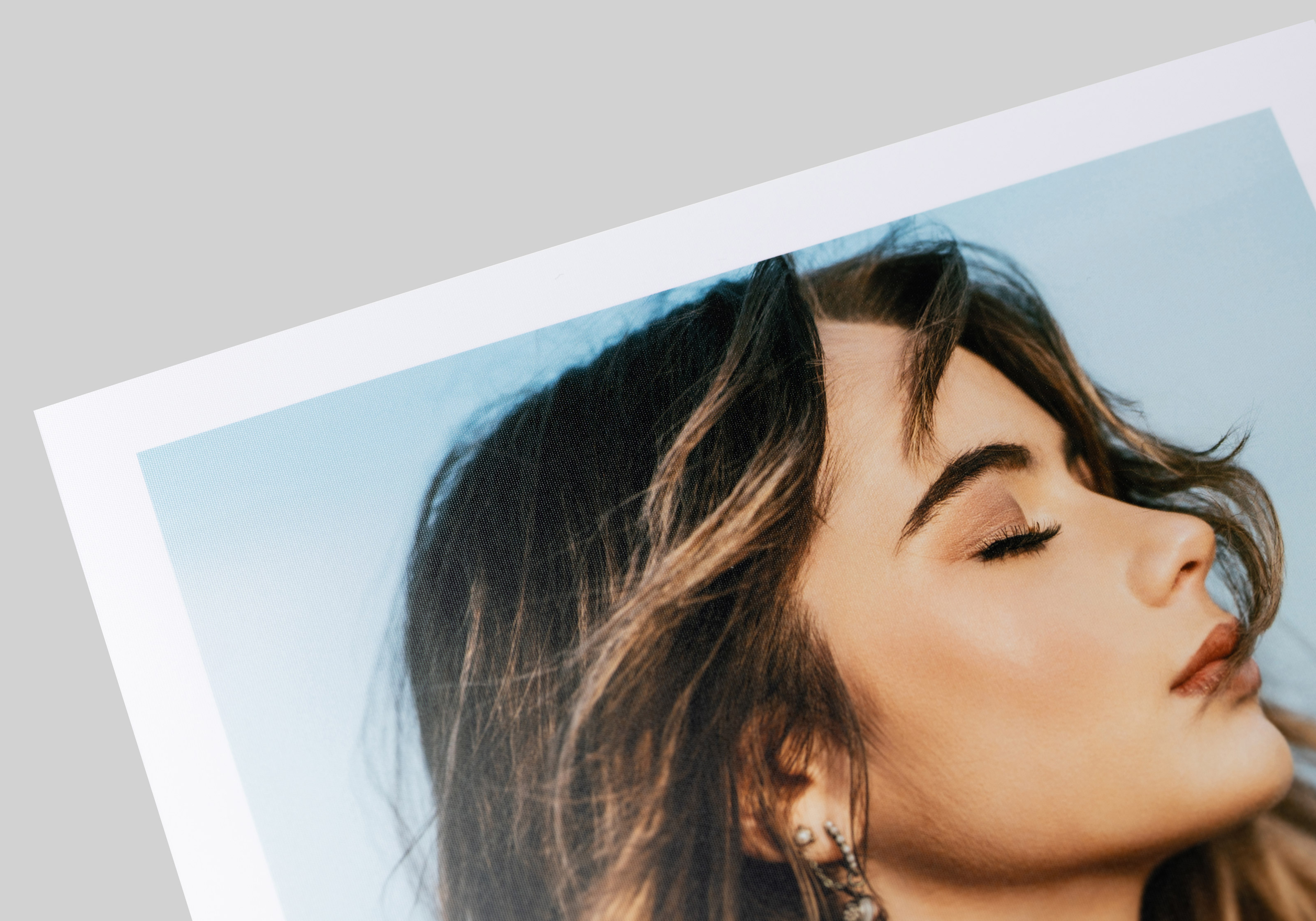 Close-up of a portrait printed on Photo Silk paper, showcasing a semi-matte finish, distinctive textural surface, and stronger color saturation.