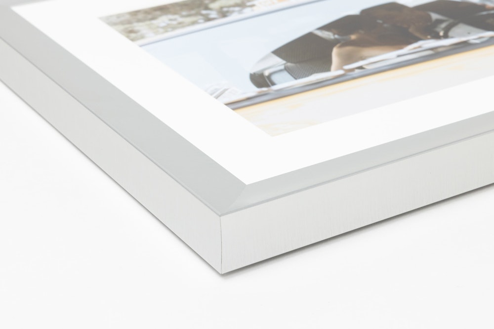 Close-up corner of a Pewter Metal Framed Print moulding on a white background