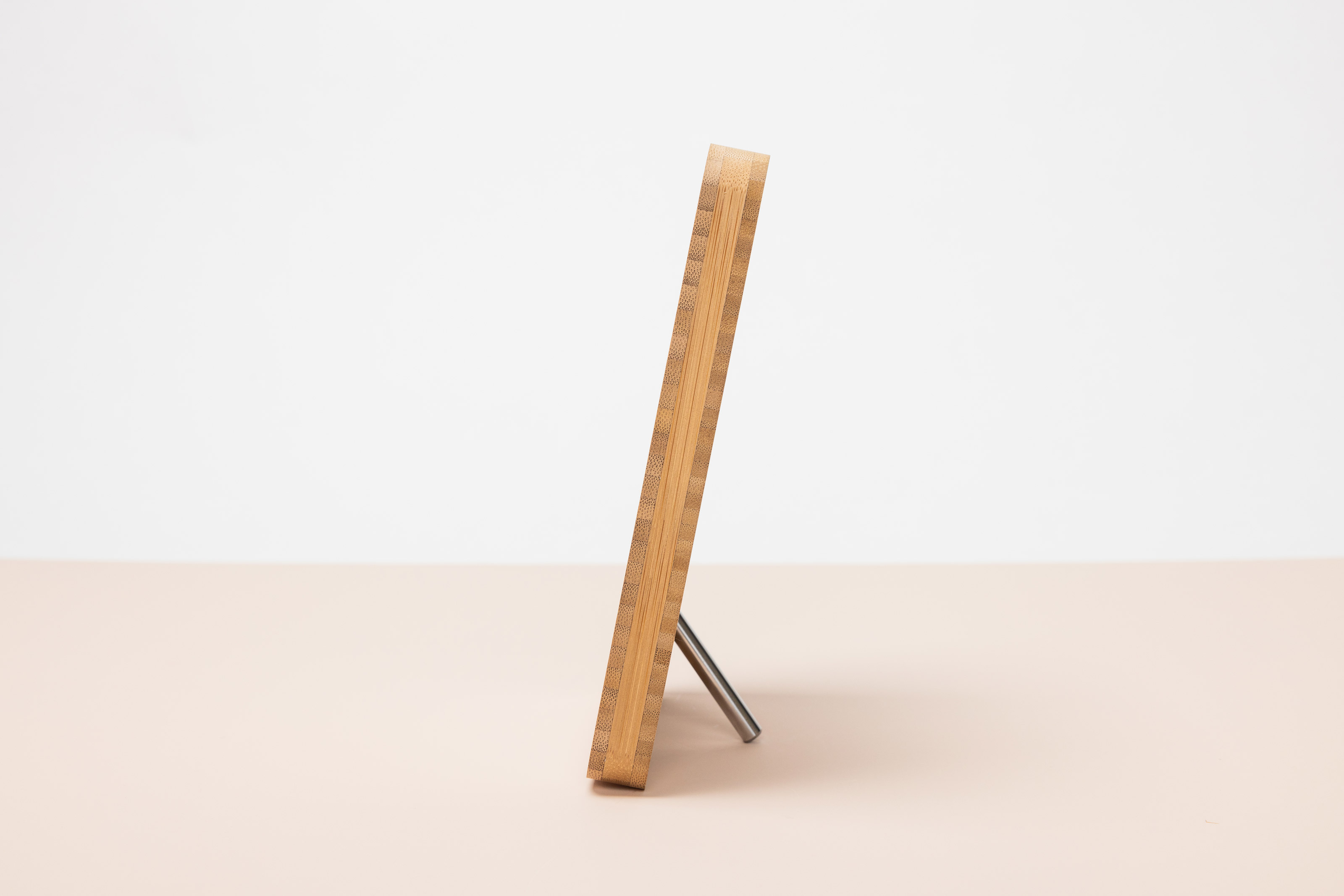 Side view of Removable Metal Stand display hardware on a 5×7 Bamboo Tabletop Frame showing how it slightly leans the frame back