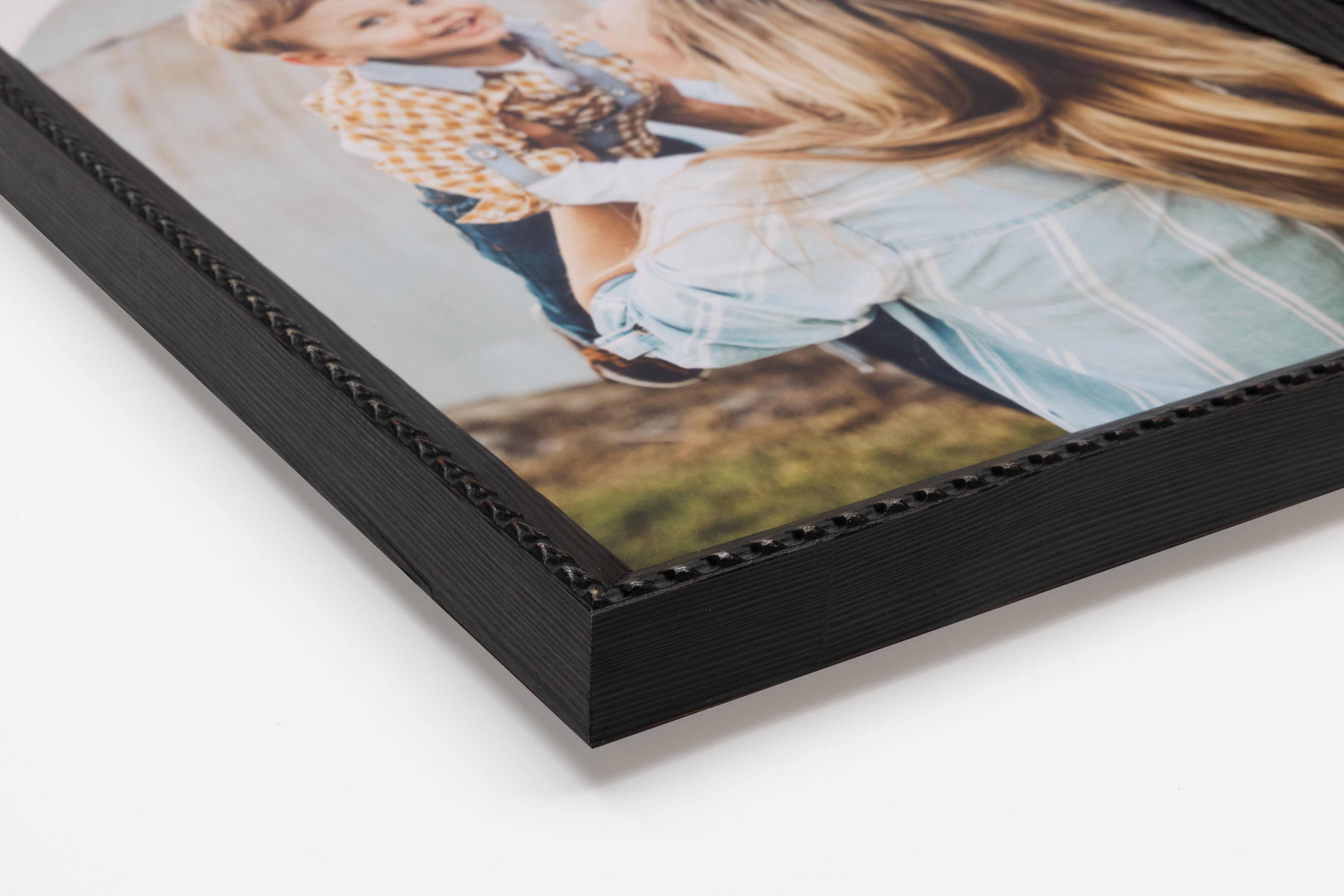 Corner detail of ⅞" Weathered Black Brimfield Frame moulding