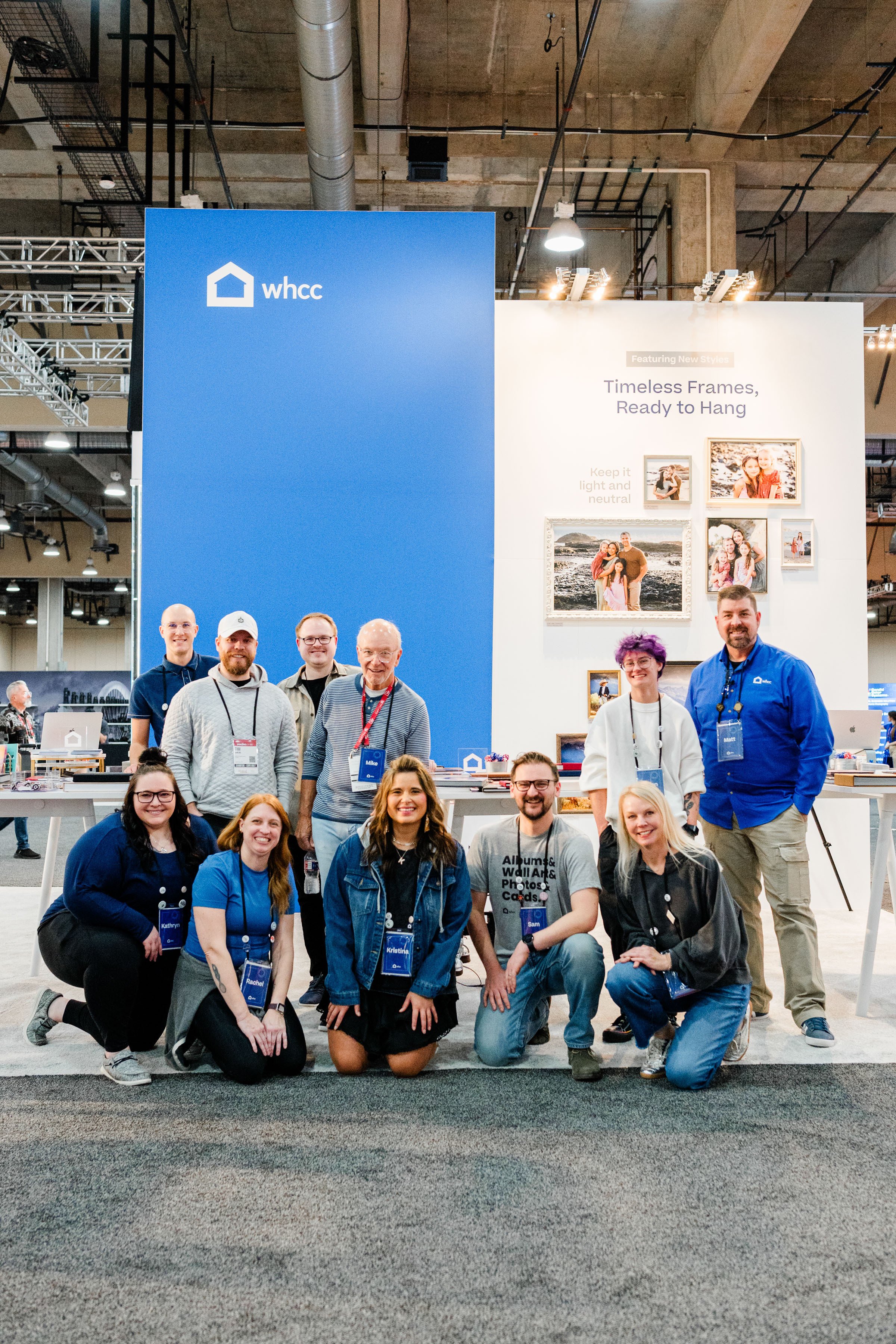 WHCC staff standing in front of a convention booth