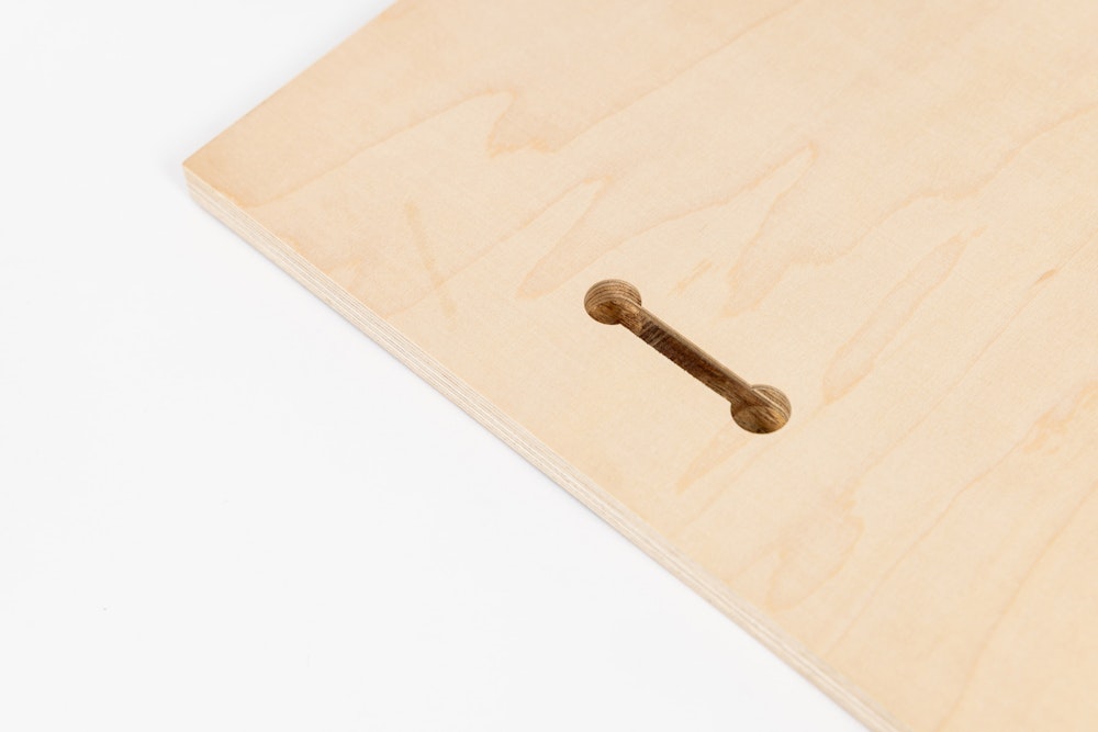 Close-up detail of pre-cut keyhole on the back of a Wood Print to use for hanging for display