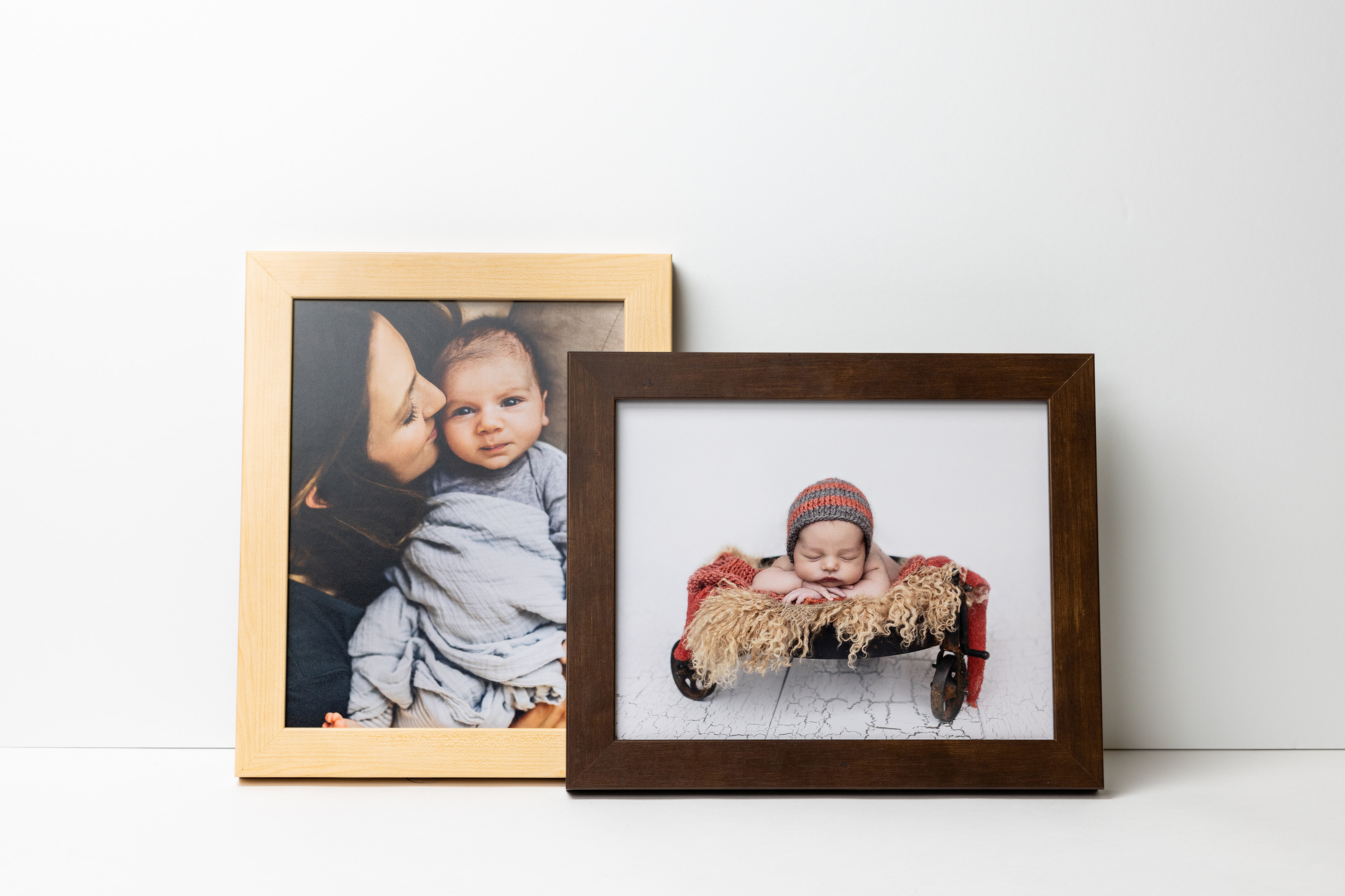 Natural and Mocha Gallery Framed Print mouldings leaning on a white wall featuring newborn portrait photography