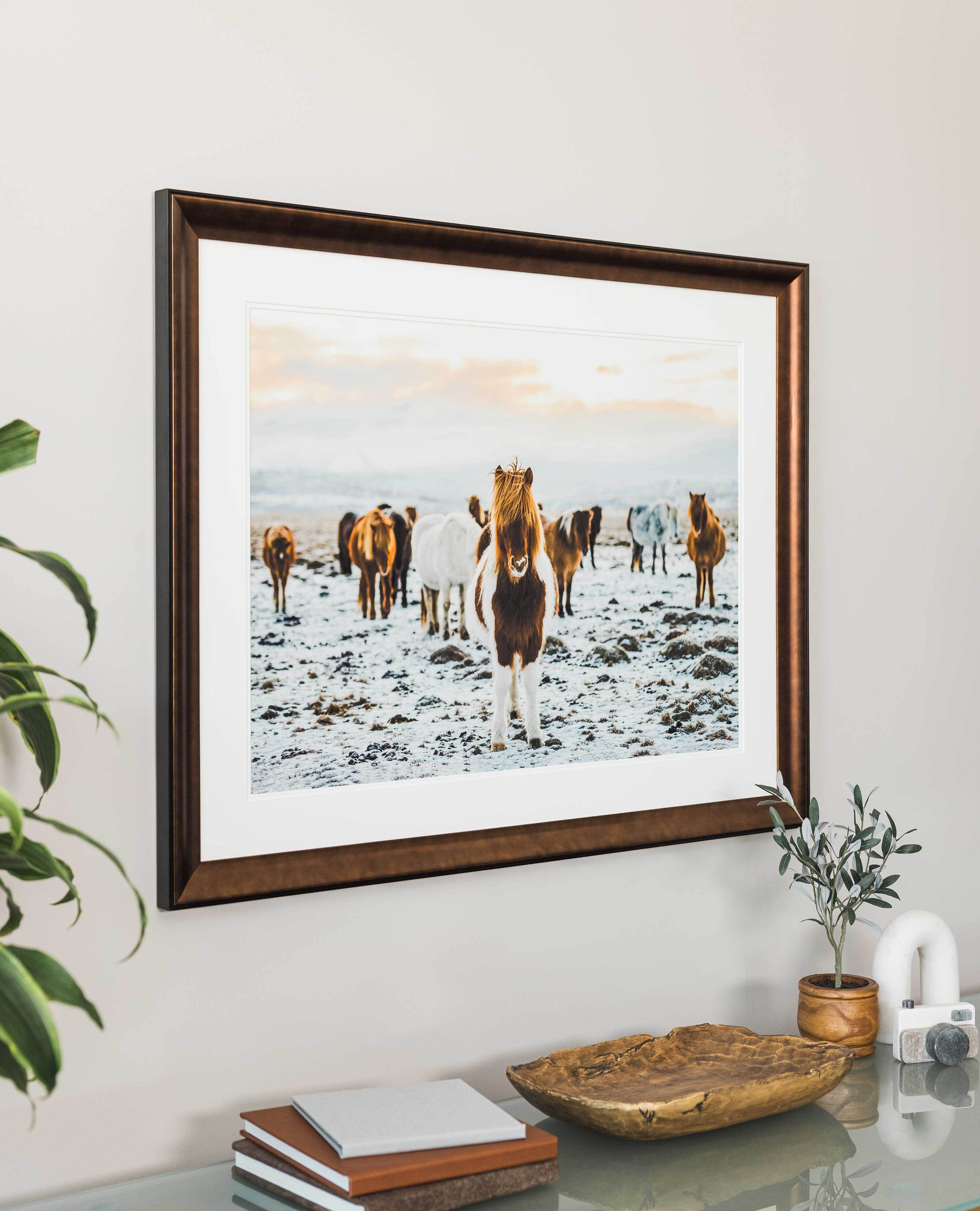professional framed 24x30 photo print with a high-quality frame hung on a wall above furniture