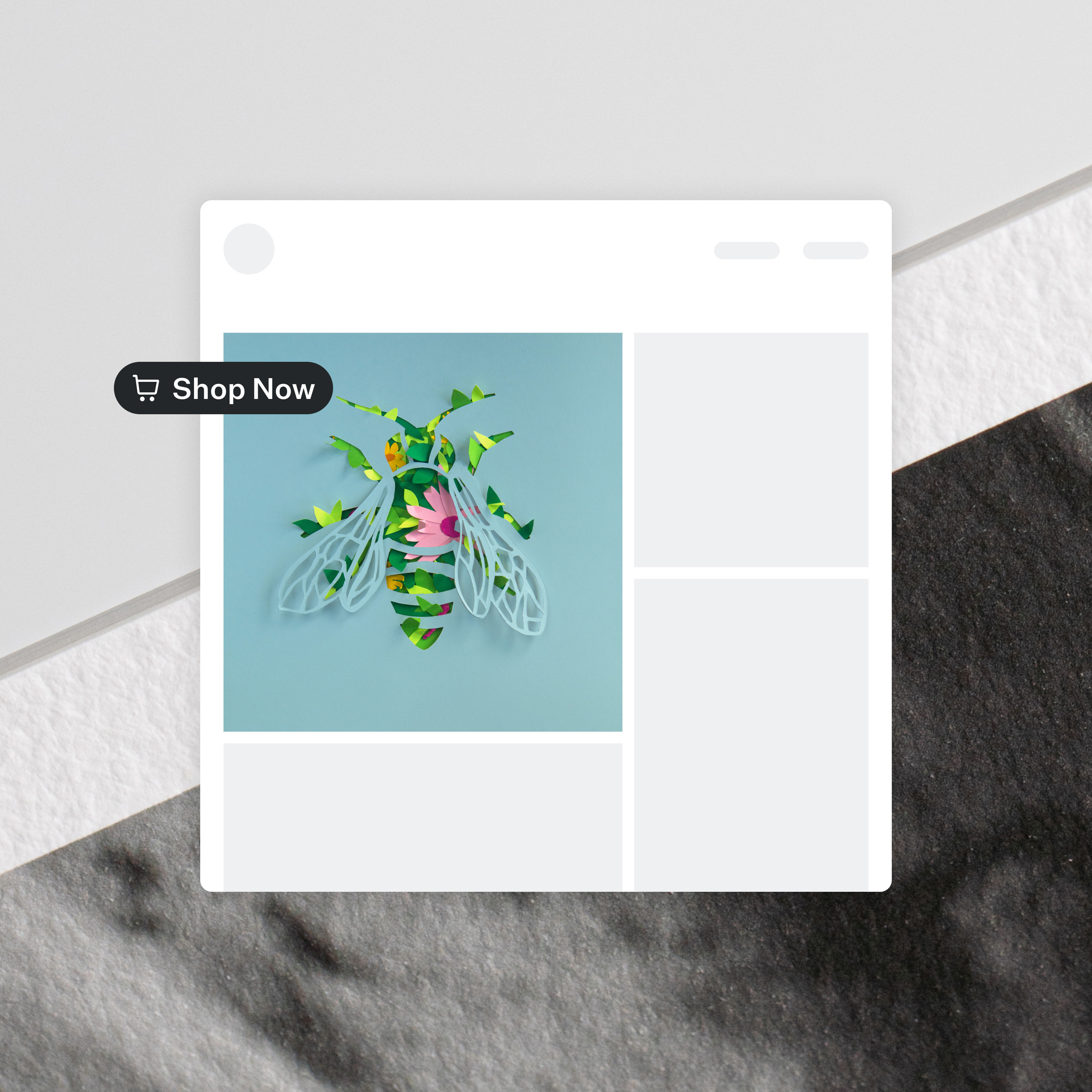Wireframe of artist portfolio website with bee and floral paper art print and "Shop Now" button floating over detailed texture of black and white Fine Art Print paper surface.