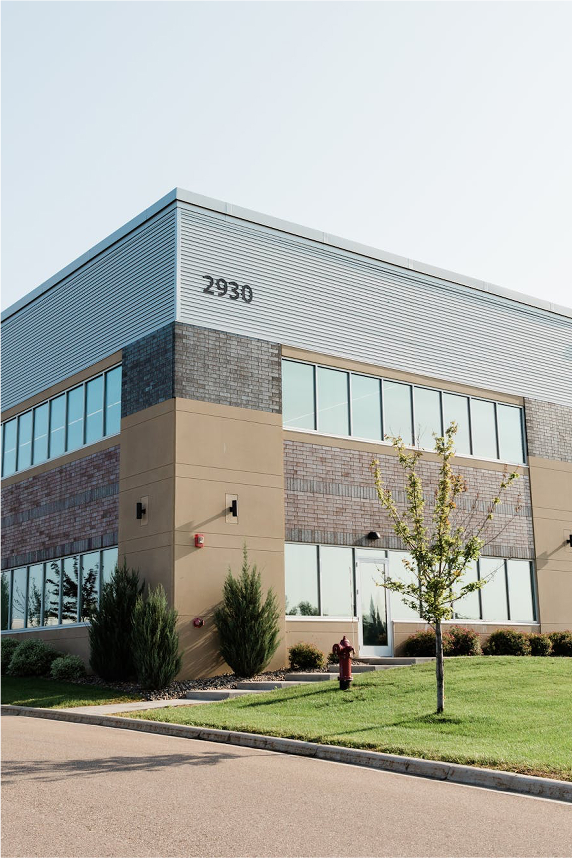 exterior of state of the art multi-floor production facility for wall art