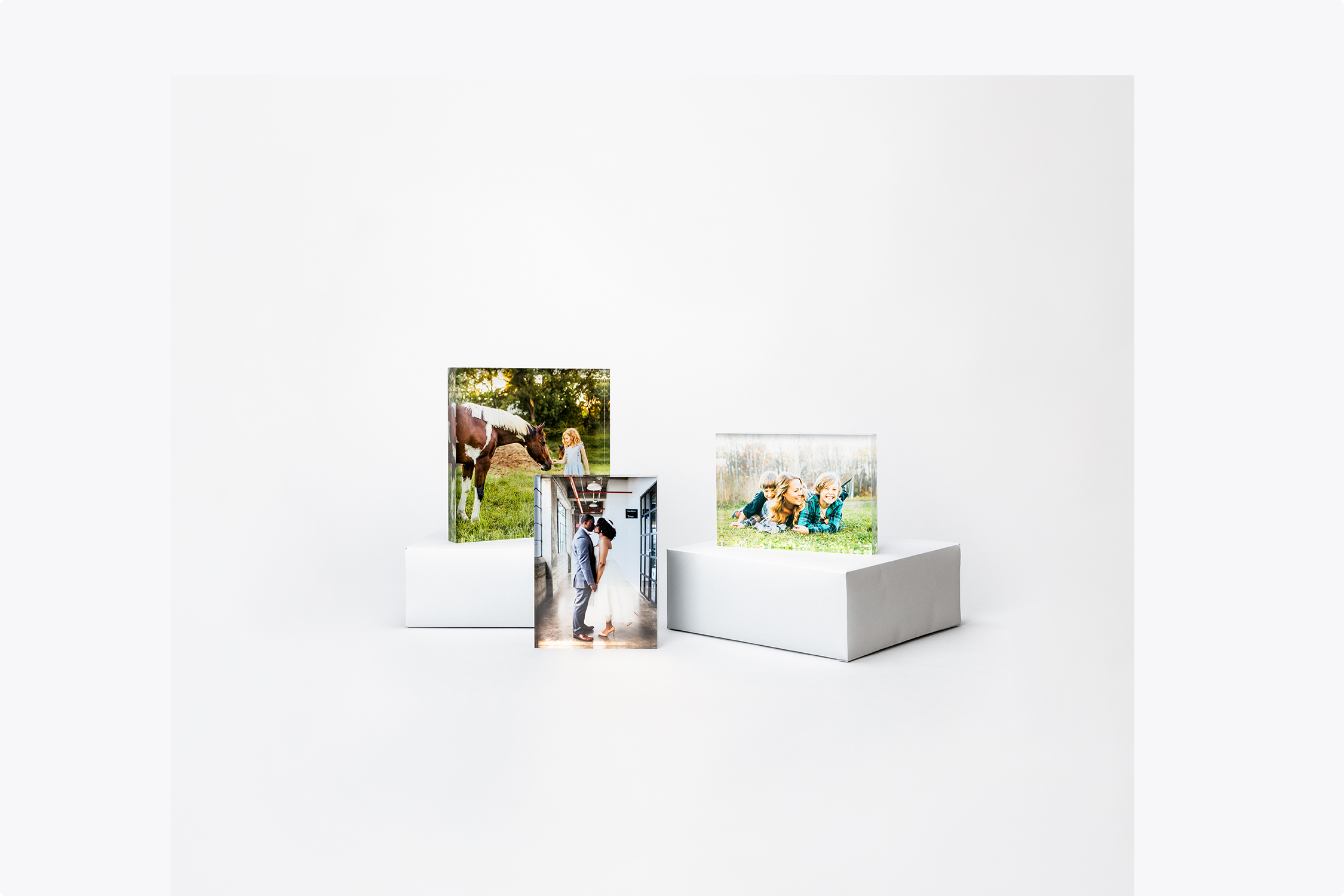 Several acrylic blocks in a display showing professional portrait photography